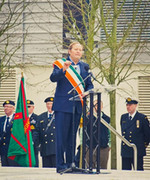 Speaker wears Tricolour Sash